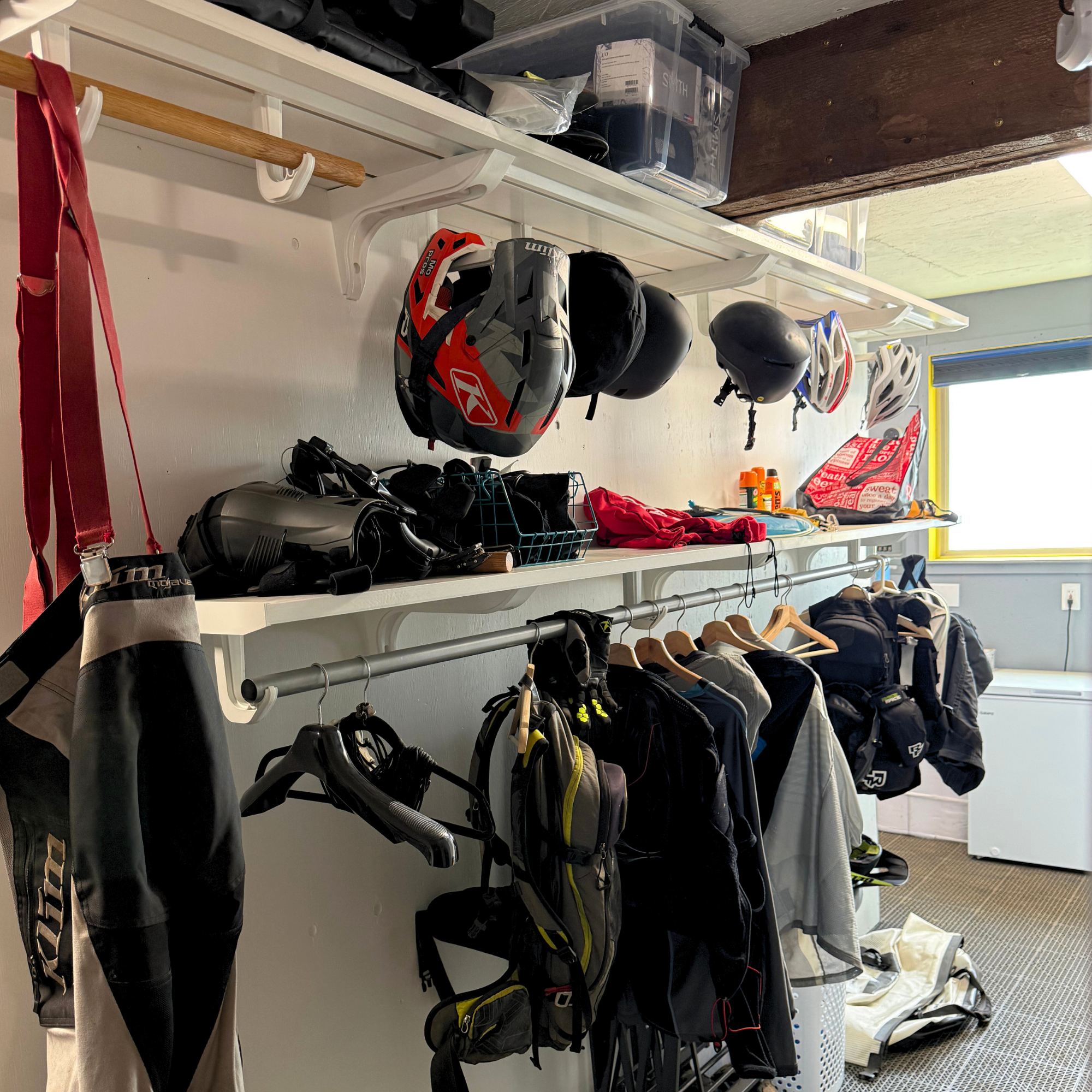 all-groups Storage room with Toden shelves holding helmets, jackets, and other gear which are heavy and perfect for football, baseball, or hockey equipment