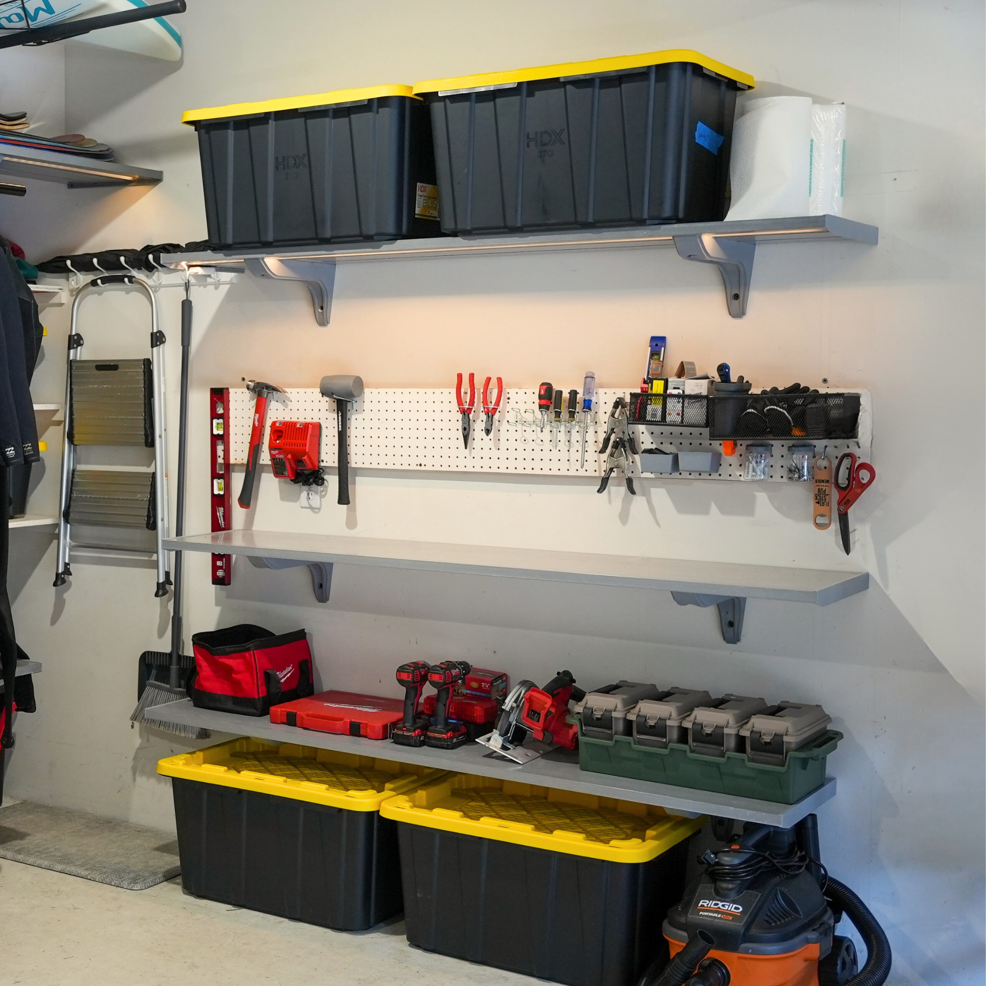 all-groups Organized garage with storage bins, tools, and equipment on Toden shelves.