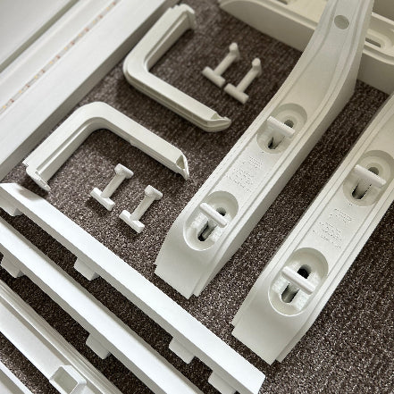 White plastic components on a textured surface
