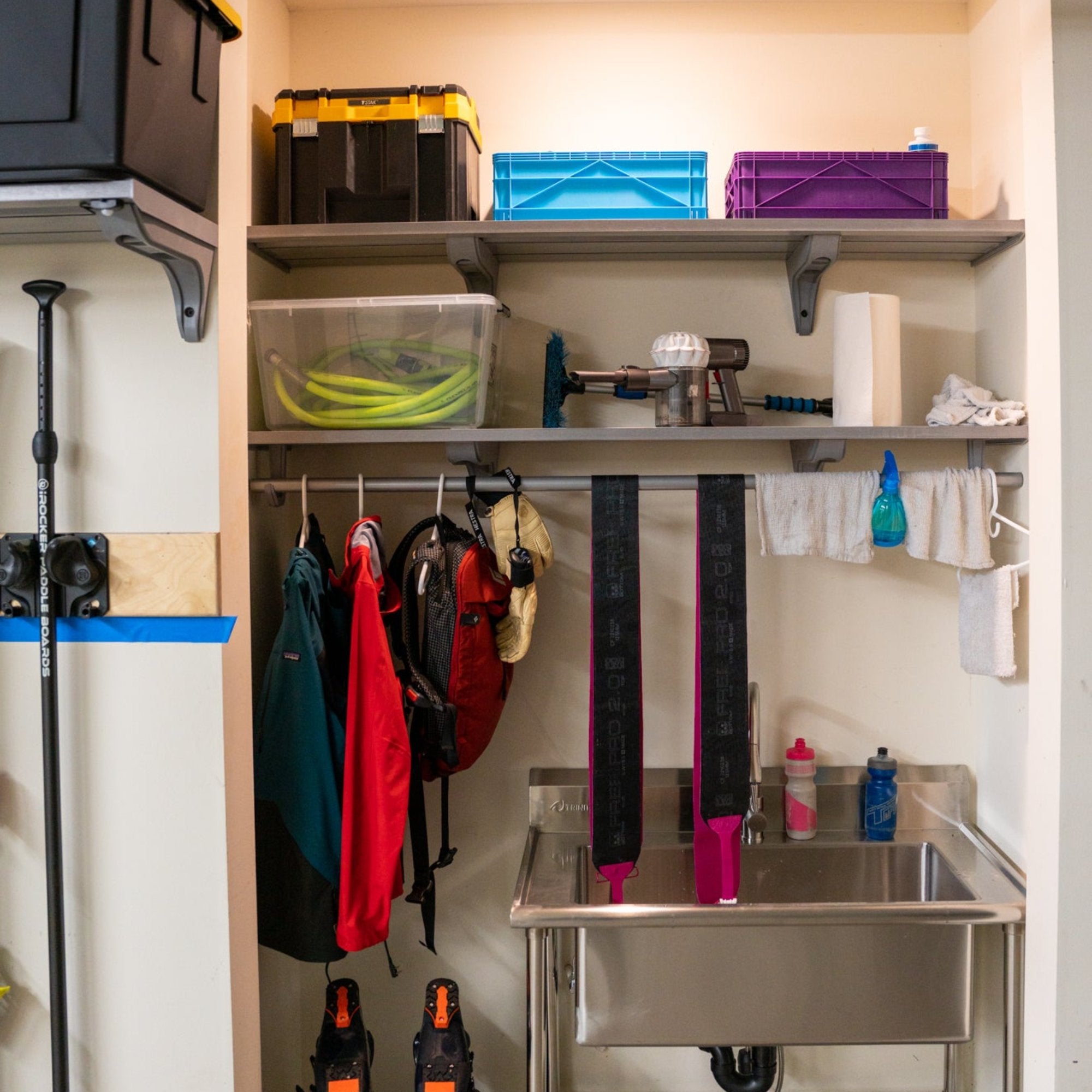 all-groups A utility sink with Toden storage shelving and closet rod to hand rags, spray bottles, and other clothes that need drying