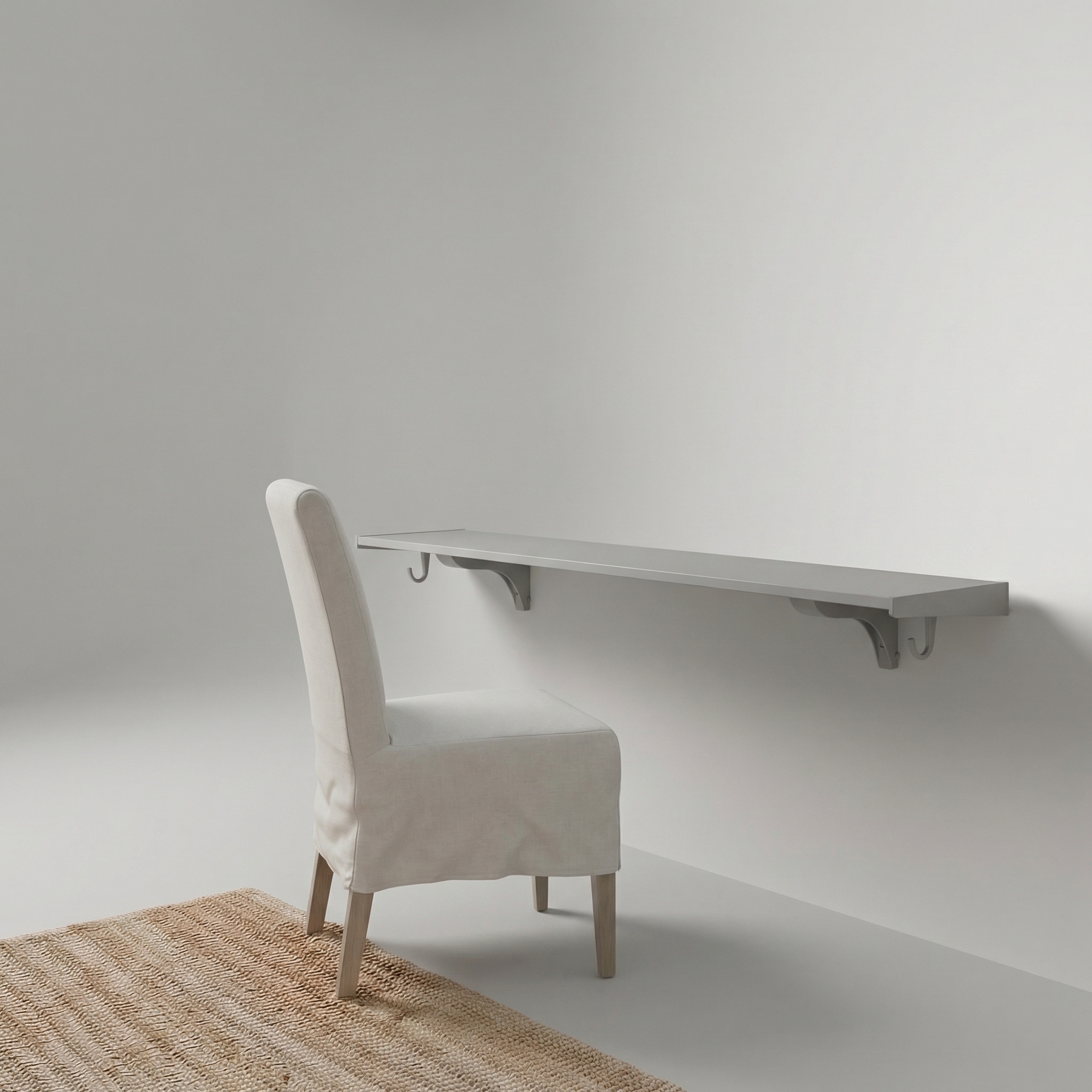 Toden gray modular surface installed as a minimalist floating desk against a neutral wall. The setup features a long-run gray desk panel supported by industrial-strength brackets with integrated snap-fit hooks. The "no diagonal support" design highlights the maximum legroom and sleek, low-profile look for a modern, clutter-free home workspace.