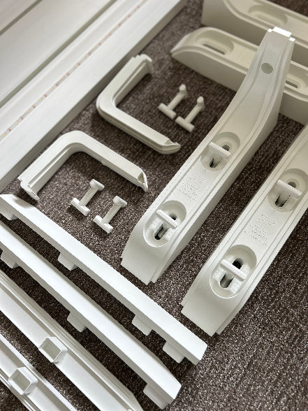 White plastic components on a textured surface
