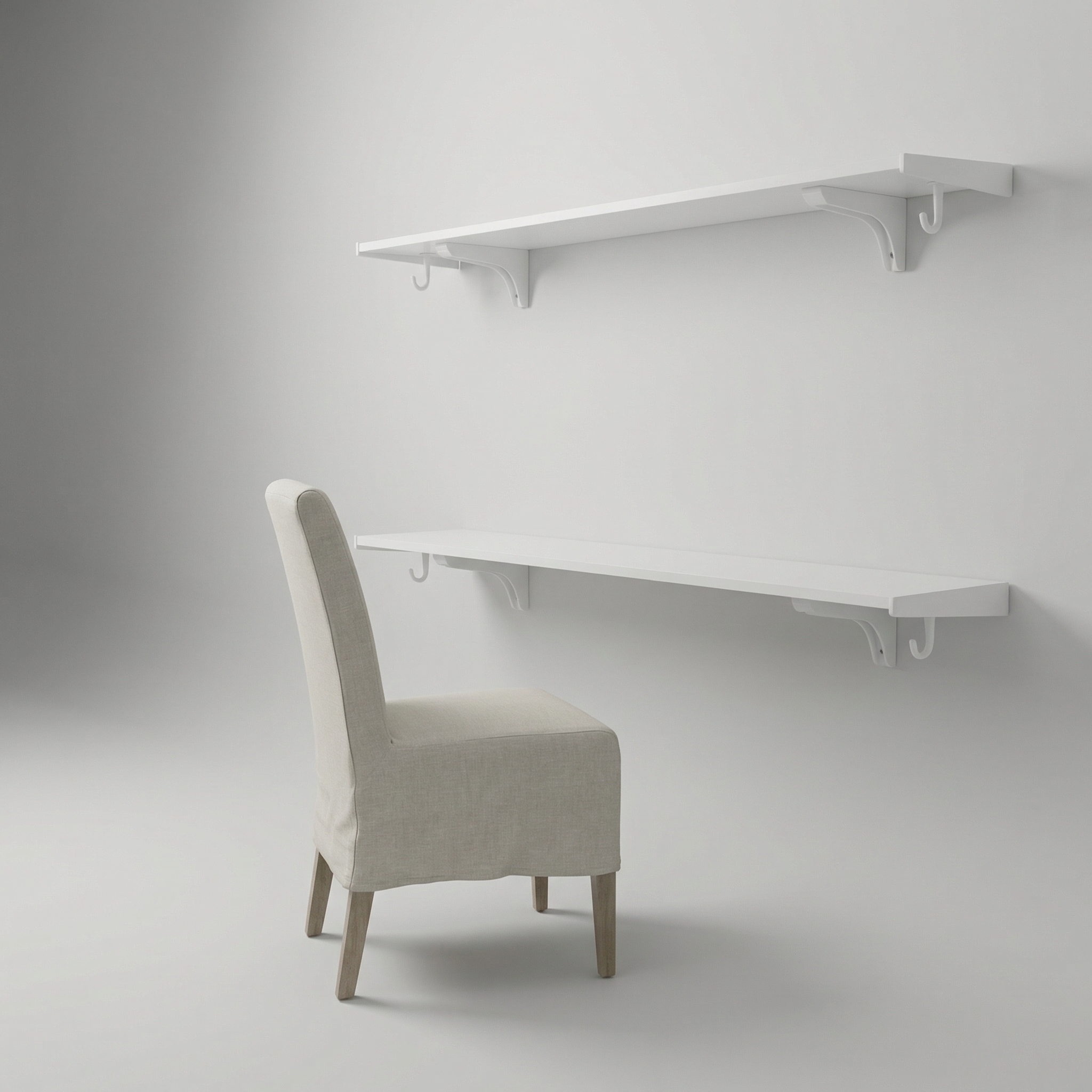 White wall-mounted desk with a chair against a plain background