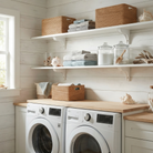Toden white modular laundry room shelving system with a double-row configuration on a white shiplap wall. Two long white floating shelves are mounted above a white washer and dryer set with a wood countertop. The shelves are styled with wicker baskets, towels, and glass jars, highlighting the sleek, no-diagonal support design and industrial-strength load capacity in a bright, coastal-themed utility space.